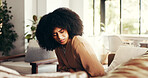 Woman, stomach and cramps or pain on sofa for menstruation, ovarian cysts and discomfort in lounge. Girl, home and abdominal ache for monthly cycle, period and tension or strain in house living room