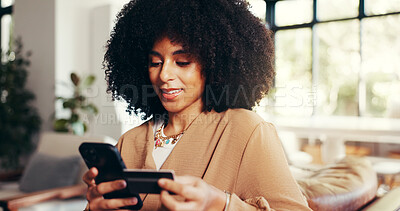 Buy stock photo Woman, credit card and phone on sofa for ecommerce, connectivity and smile for discount. African girl, typing on mobile and digital money in home for transaction, online banking and easy spending