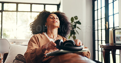 Buy stock photo Relax, music and peace with woman on sofa for streaming, connection and mindfulness. Calm audio, tablet and headphones with person in living room of home for online subscription, media and song