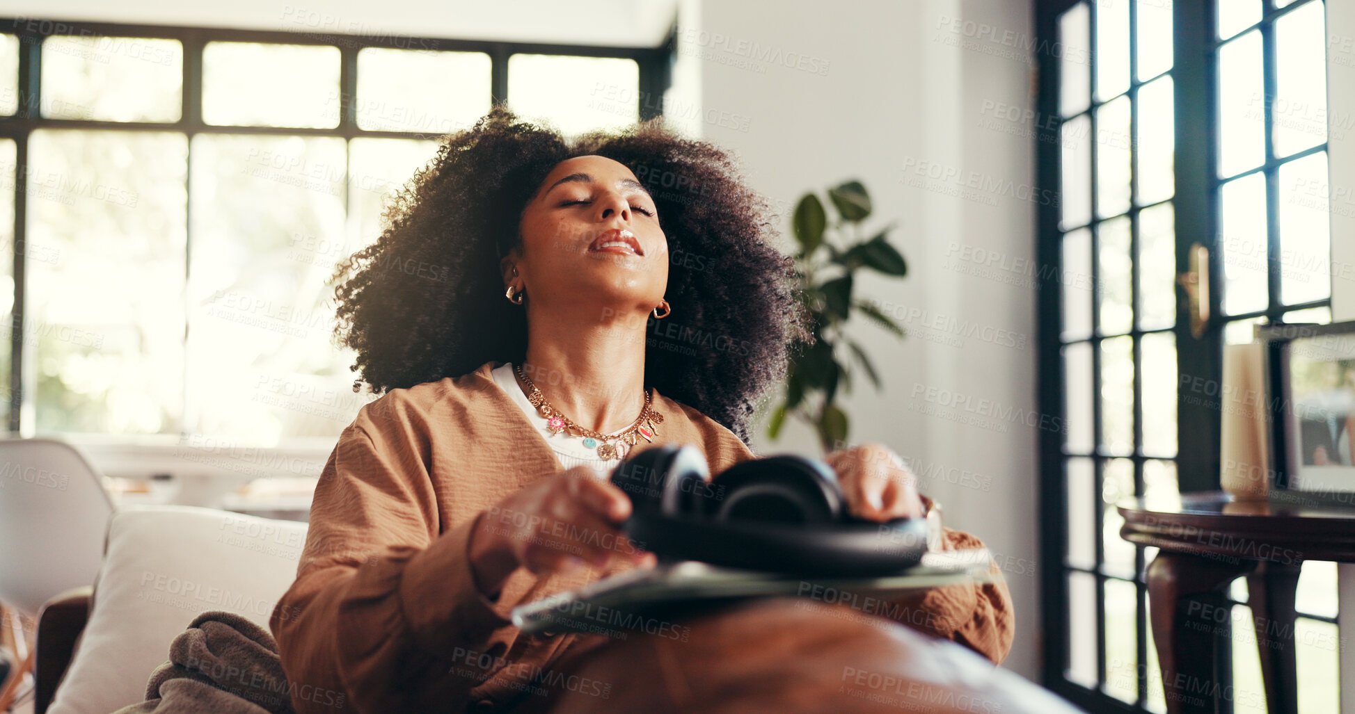 Buy stock photo Relax, music and peace with woman on sofa for streaming, connection and mindfulness. Calm audio, tablet and headphones with person in living room of home for online subscription, media and song