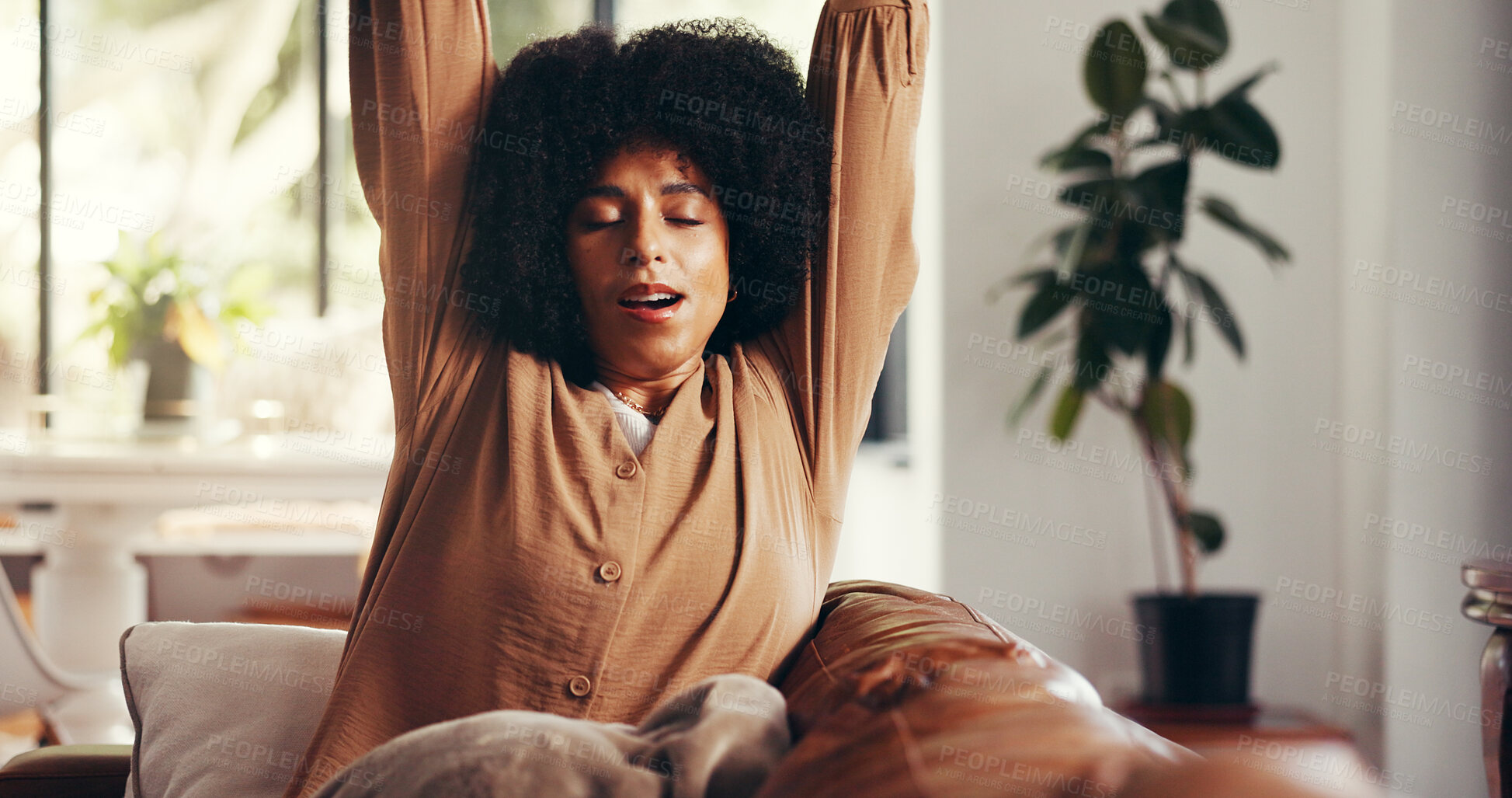 Buy stock photo Happy woman, relax and stretching on sofa for morning, awake or fresh start in living room or home. Calm, female person and warm up for flexibility, circulation or stress relief on couch in house
