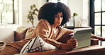 African woman, reading and tablet at house for email, design feedback and project schedule. Graphic designer, remote work and digital to review art, online research and information on web application
