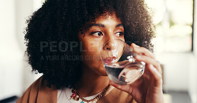 Buy stock photo Home, woman and drinking water for health, wellness or benefits for diet. Thirsty African person, hydration and glass in living room with mineral liquid for natural detox, nutrition or fresh beverage