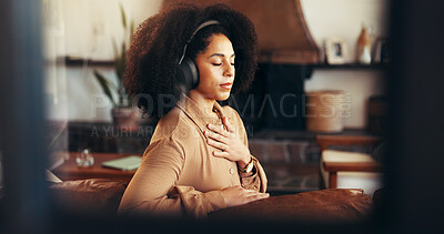 Buy stock photo Meditation, relax and woman with headphones in home for calm, peace and zen. Music, mindfulness audio and African person listening to podcast, streaming radio or breathe for self care in living room