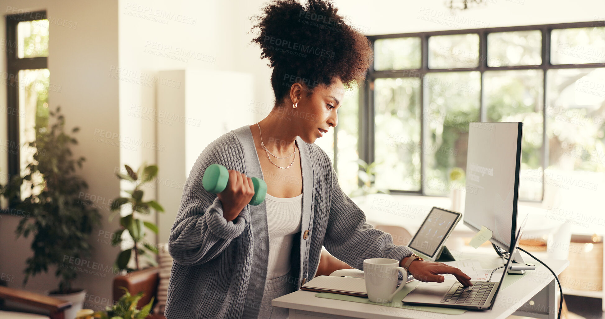 Buy stock photo Multitasking, freelancer and woman with dumbbell, computer or standing desk for project or exercise. Research, journalist and African person with equipment for workout, remote work or fitness in home