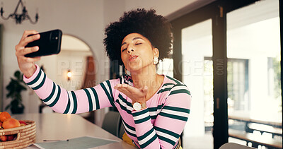 Buy stock photo Woman, blow kiss or selfie in home for social media, update blog or online connectivity. African influencer, photography or gesture in house for dating app interaction, follower engagement or contact