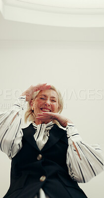 Buy stock photo Portrait, business and woman with frame pose for comedy, goofy expression and playful fun. Below, mature person and pov with confident employee for silly reaction, humor and positive attitude at work