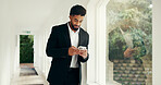 Phone, window and businessman in office with communication, networking or email for investment. Cellphone, morning and male financial manager with contact for online finance report in workplace.