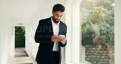 Buy stock photo Phone, window and businessman in office with communication, networking or email for investment. Cellphone, morning and male financial manager with contact for online finance report in workplace.