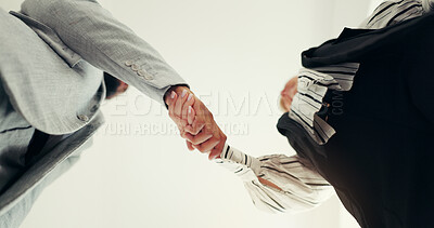 Buy stock photo Shaking hands, partnership and business people in office with deal, agreement or collaboration. Corporate, welcome and finance manager with client for handshake on investment contract from below