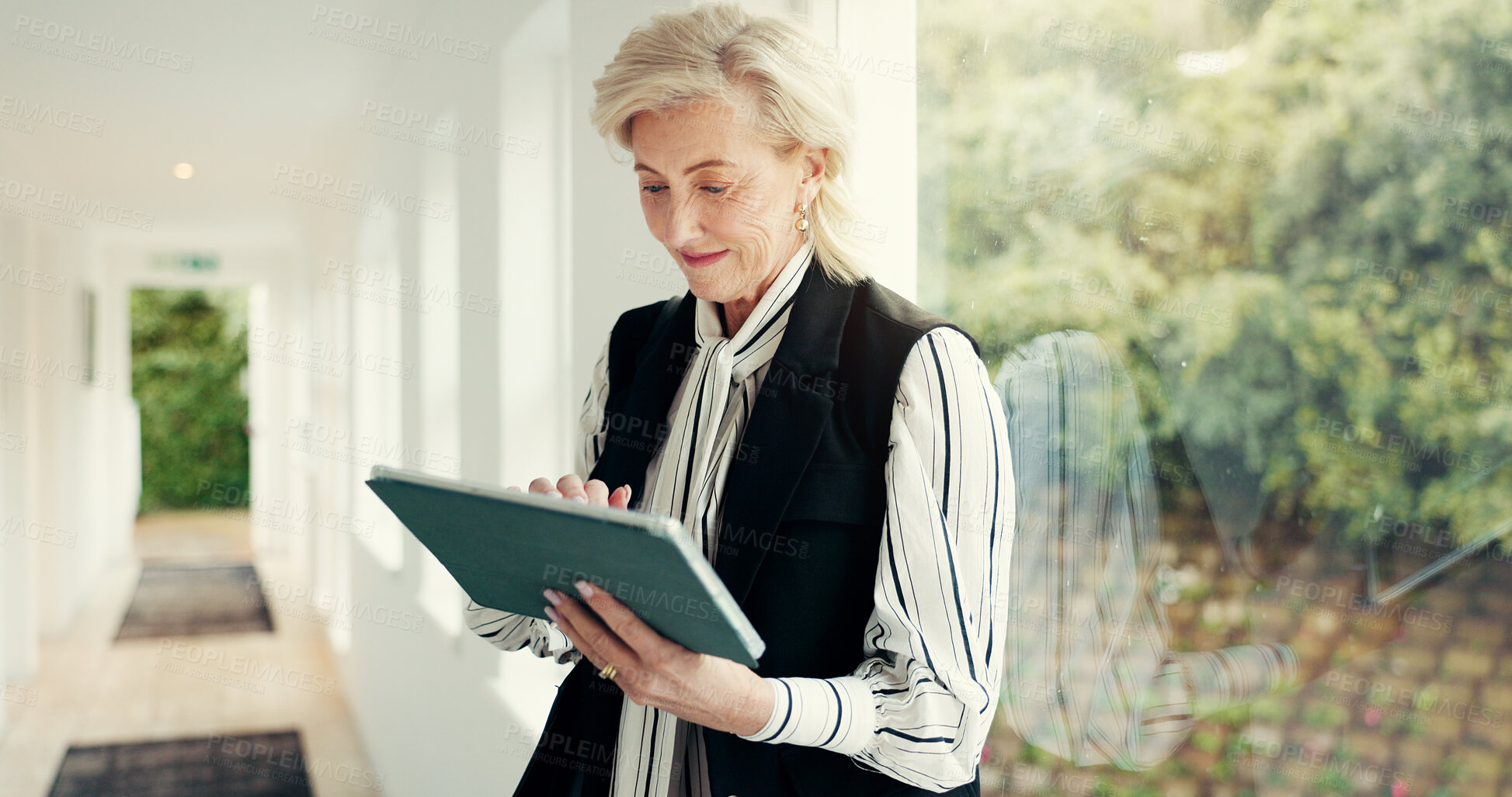 Buy stock photo Business, woman and reading on tablet at house for research, email client and selling property. Mature realtor, digital or web for real estate sales, review information and schedule viewing of rental