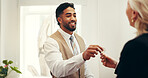 Happy man, keys and hotel lobby for businesswoman, welcome or registration for accommodation. People, check in and concierge with mature client, help desk and hospitality for suite booking at lodge