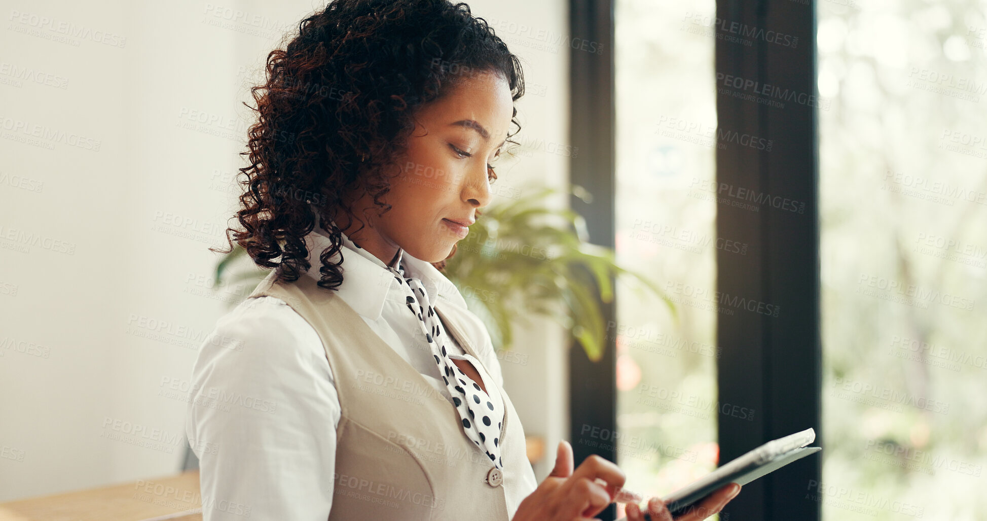 Buy stock photo Hotel, receptionist and woman with tablet, serious and checking reservation on website and schedule. Motel, concierge and person with tech for booking info, update and research for request on app