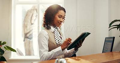 Buy stock photo Hotel, receptionist and woman with smile, tablet or research for reservation on website or schedule. Motel, concierge and person with tech for booking info, update and browsing for request on app