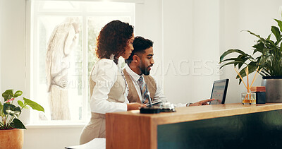 Buy stock photo Hotel, receptionist and colleagues with computer, research and collaboration for reservation on web. Online, man and woman with tech for registration info, teamwork and planning for schedule in motel