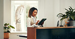 Hotel, receptionist and woman with tablet, browsing and checking reservation on website or schedule. Motel, concierge and person with tech for booking info, update and research for request on app