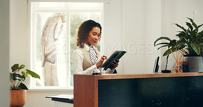 Buy stock photo Hotel, receptionist and woman with tablet, browsing and checking reservation on website or schedule. Motel, concierge and person with tech for booking info, update and research for request on app