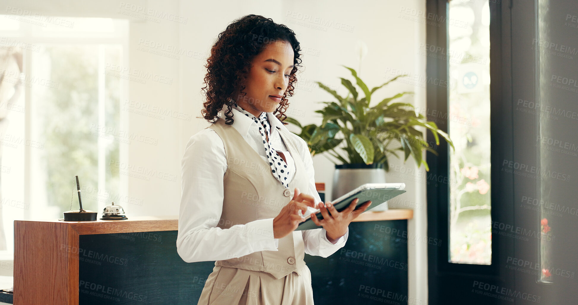 Buy stock photo Hotel, receptionist and woman with tablet, research and checking reservation on website or schedule. Motel, concierge and person with tech for booking info, update and browsing for request on app