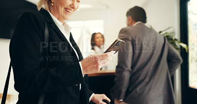 Buy stock photo Business, woman and phone at hotel reception for check in, reservation and booking confirmation. Mature person, mobile and wait for assistance, schedule update and information of resort availability