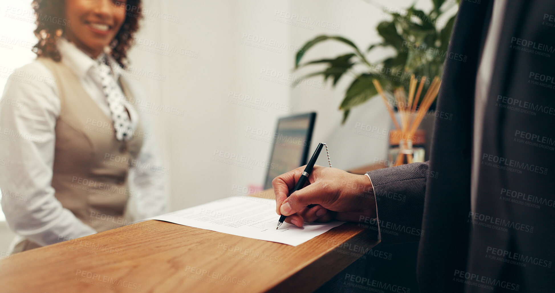 Buy stock photo Hands, document and signature at hotel, concierge or registration for accommodation at resort. People, check in and paperwork with client, writing or help desk for suite booking at hospitality lodge