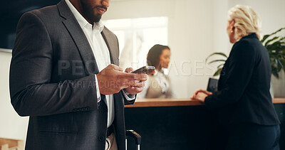 Buy stock photo Businessman, hotel and waiting with phone for check in, accommodation or online booking in resort. Man, hands and typing with mobile smartphone for luggage, stay or hospitality at front desk service