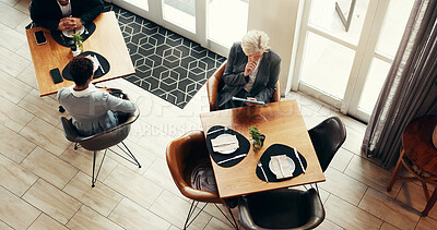 Buy stock photo Mature business woman, tablet and coffee shop for remote work, reading and above for review at diner. Person, tech and check notification with application, scroll and contact on web at cafeteria