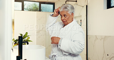 Buy stock photo Senior woman, comb and brush hair in bathroom for beauty, natural growth and grooming routine. Elderly person, mirror and cosmetic tools with scalp treatment, collagen benefits and textures at house