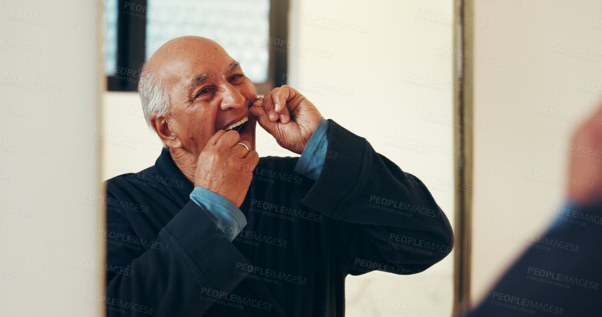 Buy stock photo Dental health, mirror and senior man with flossing in bathroom for morning routine in home. Oral care, reflection and elderly male person with string for cleaning teeth with hygiene in apartment.
