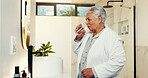 Drinking water, morning and senior woman in bathroom, thirsty and wellness with retirement. House, pensioner and elderly person with glass, liquid and hydration with nutrition, healthy and start day
