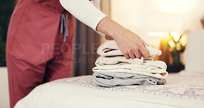 Buy stock photo Hands folding clothes, bed and house for hygiene routine, services and nurse in bedroom. Person, caregiver and packing clean laundry with garments, fabric or assisted living career at retirement home