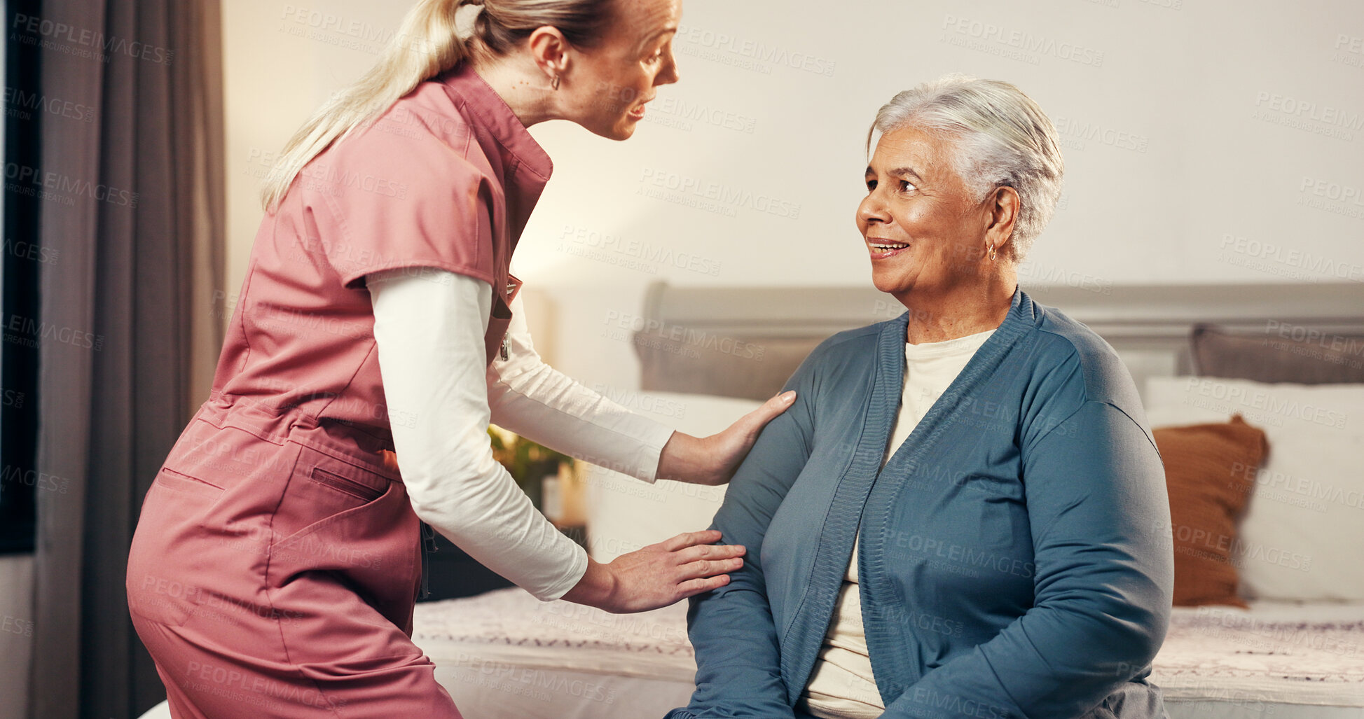 Buy stock photo Caregiver, senior woman and happy in nursing home for assisted living, homecare and help. Elderly patient, nurse and talking in bedroom for healthcare, frail care and support at retirement facility