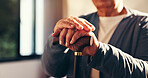 Senior hands, walking stick and recovery in home for injury, stroke or osteoporosis in retirement. Elderly person with disability, wooden cane and mobility aid for balance, steps and rehabilitation