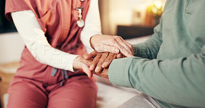 Buy stock photo Caregiver, senior man and holding hands in home for medical service, empathy and compassion. Assisted living, night and nurse with comfort to elderly patient on bed for healthcare support and bonding