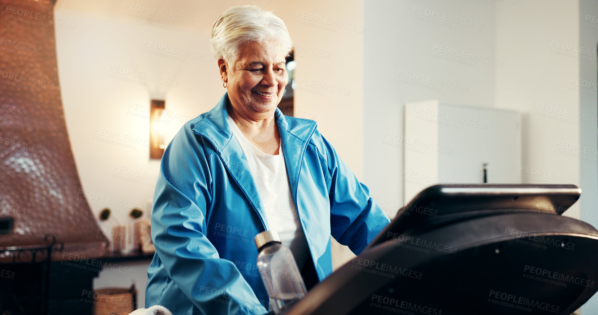 Buy stock photo Treadmill, senior woman and exercise in home for muscle strength, cardio workout and burn calories. Retirement fitness, old person and walking on machine for physical activity and mobility wellness
