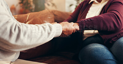 Buy stock photo Praying, holding hands and support with old couple on sofa for worship, gratitude and peace. Religion, spiritual connection and faith with people in living room of home for trust, love and belief