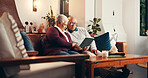Home, tablet and senior couple on sofa, bonding together and online reading in living room. Apartment, pensioner and old man on couch, woman and marriage with technology, social media and connection