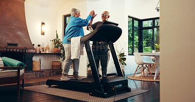 Buy stock photo Senior couple, treadmill and high five for fitness in home, walk and support with training in retirement. Elderly man, woman and motivation with gym equipment, machine or steps with exercise in house