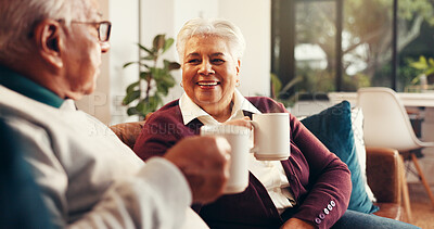 Buy stock photo Coffee, happy and senior couple on sofa in home with conversation, bonding or laughing together. Relax, cappuccino and elderly man with woman for retirement in living room for calm morning in house.
