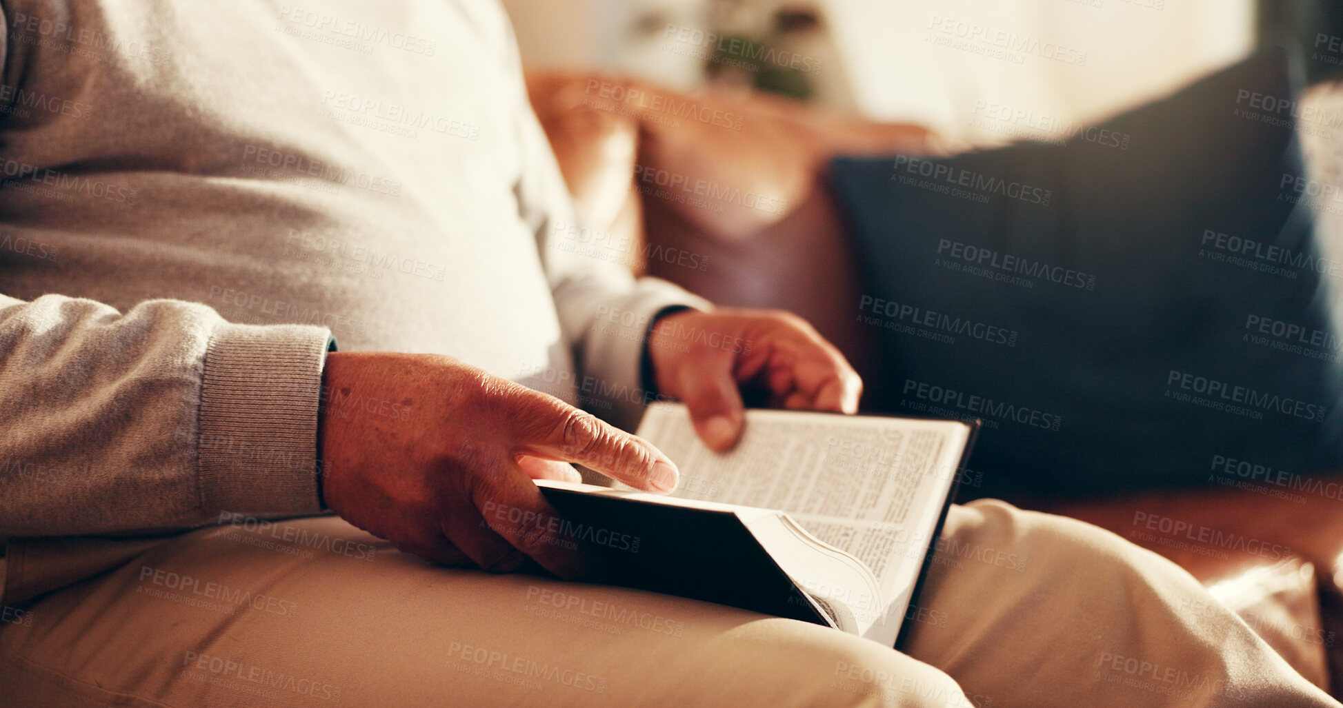 Buy stock photo Hands, bible and religion on sofa in home, reading or study for Christian faith in living room. Senior person, holy book or scripture for learning knowledge, wisdom or text for God in retirement