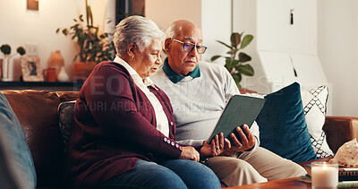 Buy stock photo House, tablet and old couple on couch, relax and bonding together with internet in living room. Online reading, pensioner and senior man on sofa, woman and relationship with tech, social media or app