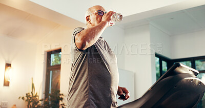 Buy stock photo Senior man, fitness and water with treadmill in home for workout, exercise or hydration. Active, elderly or male person drinking mineral liquid on running machine for cardio break, rest or recovery