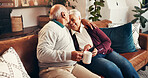 Home, smartphone and old couple on couch, funny meme and conversation in living room. Cellphone, laughing and old man on sofa, woman and relationship with tech, social media and humor with love