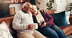 Home, cellphone and old couple on sofa, funny and bonding together with smile in living room. Smartphone, laughing and senior man with woman, joke and relationship with tech, social media and humor