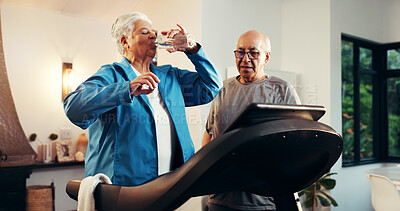 Buy stock photo Senior woman, treadmill and drinking water in home for training, rest or hydration in retirement. Elderly man, couple and partner with bottle, gym equipment and exercise machine with support at house