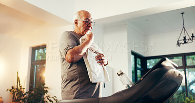Buy stock photo Treadmill, senior man and towel for exercise break, tired and training recovery in home. Cardio machine, wipe sweat and person rest for wellness, health and fitness with fatigue in retirement