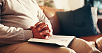 Worship, hands and bible with man on sofa for prayer, gratitude and peace. Religion, spiritual connection and faith with person and book in living room of home for trust, holy text and belief