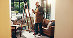 Canvas, senior man and painting with headphones in home for art, music inspiration and creativity. Artist, radio and old person with palette for retirement hobby, fine motor skills or audio playlist
