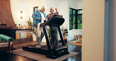 Buy stock photo Treadmill, music and senior couple in home for dance, fitness and training together. Cardio machine, woman and man with headphones for steps, workout and happy with audio for health in retirement