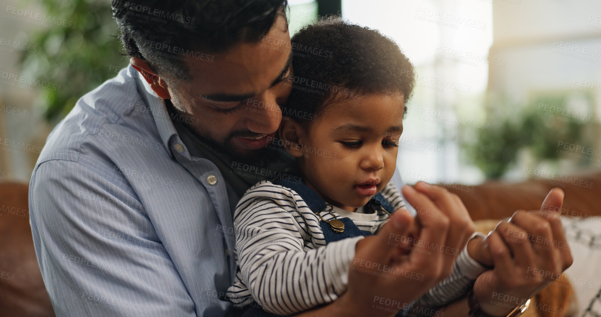 Buy stock photo Relax, holding hands and father with son on sofa for love, support and security together. Bonding, growth and child development with man and baby in living room of family home for trust and care