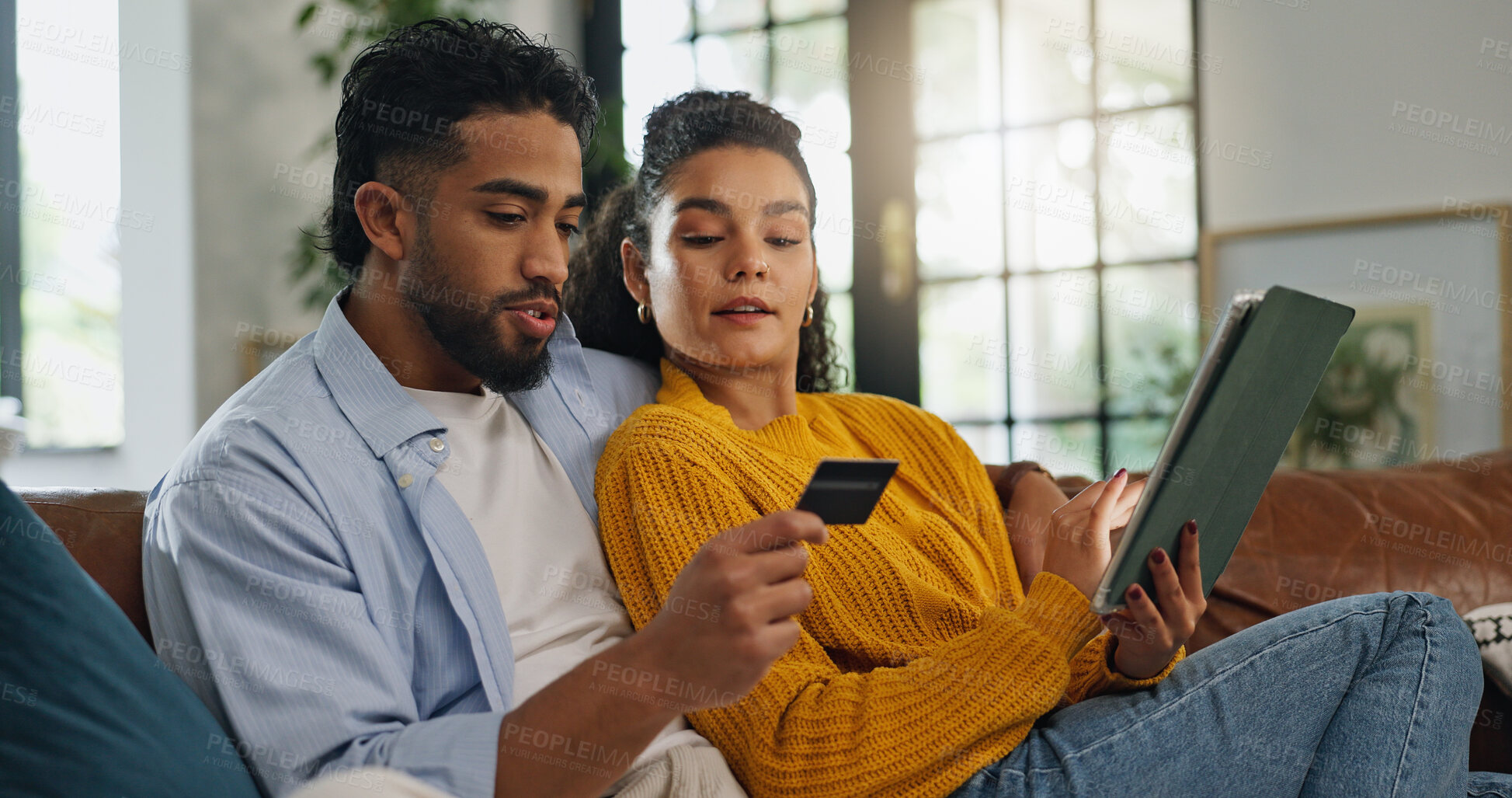 Buy stock photo Couple, credit card and tablet on sofa for online shopping, sale and easy payment in living room. People, digital banking and fintech with application, deal or discount with ecommerce at apartment